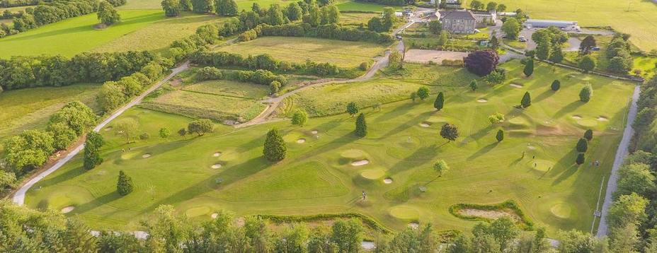 Drone ariel image of Newmarket's Pitch & Putt Course with IRD Duhallow's, James O'Keeffe Institute seen in the background with a beautiful sunset