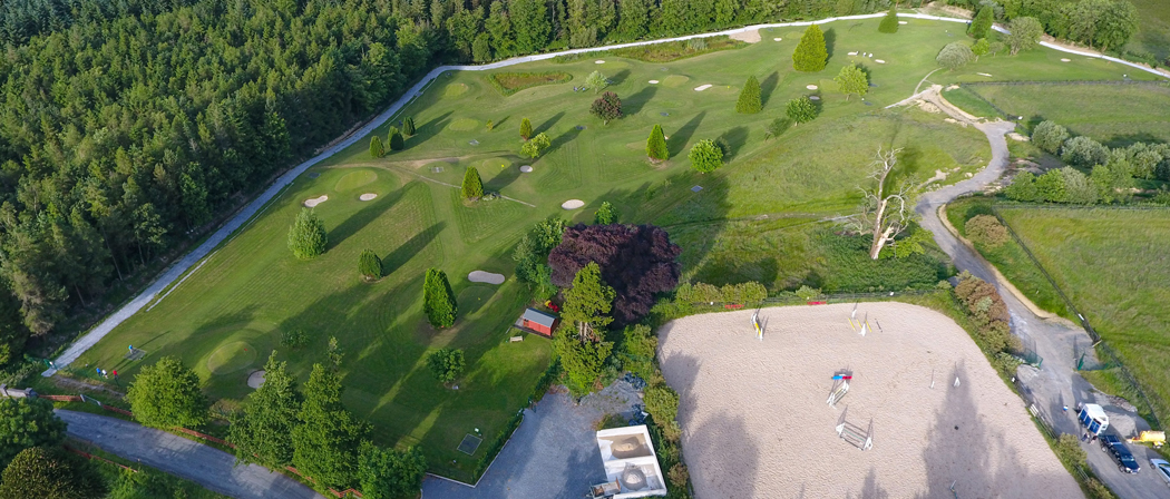 Drone ariel image of Newmarket's Pitch & Putt Course with IRD Duhallow's, James O'Keeffe Institute seen in the background with a beautiful sunset